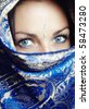 Close-up portrait of the female face in blue sari. Vertical photo - stock photo